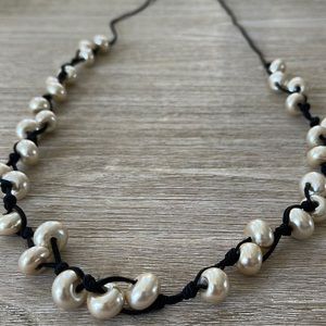 Pearls on a black cord necklace